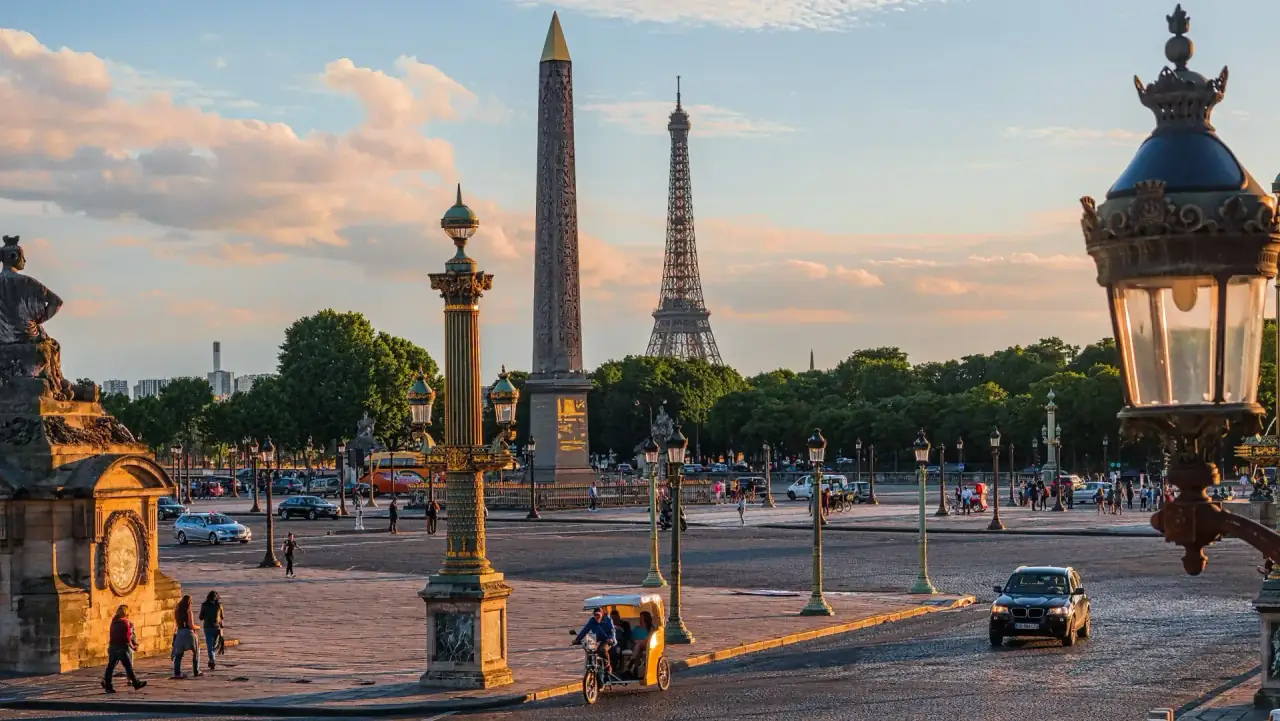 Place de la Concorde at golden hour, with the obelisk and the Eiffel Tower behind it